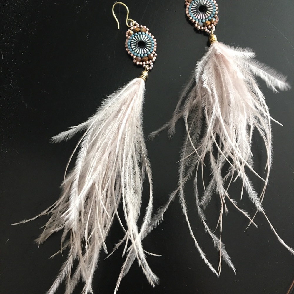 Feather statement earrings